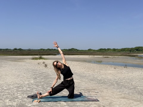 Jena in gate pose on the sand flats at North Topsail Beach